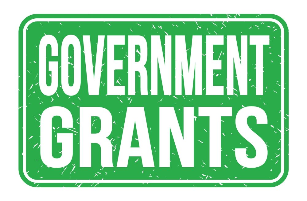 GOVERNMENT GRANTS, words written on green rectangle stamp sign