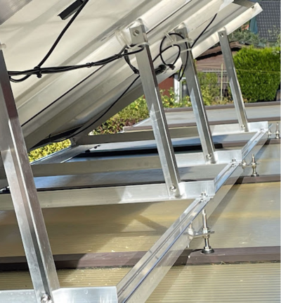 Solar Panels on a flat roof using a cable. - Solar panels installed in a London home.