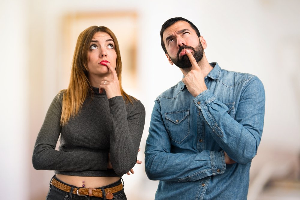 Man-and-woman-thinking-on-unfocused-background.jpg