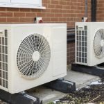 Two-air-source-heat-pumps-installed-on-the-exterior-of-a-modern-house