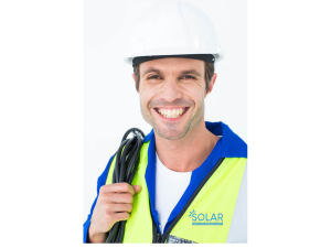 Happy Electrician Holding Wire Cable. Wearing Solar Panel Installers Uk Logo On Overalls