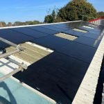 Black Solar Panels Fitted To Metal Commercial Roof In Norfolk. Solar Panel Installers Norwich