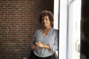 Businesswoman Standing By Window